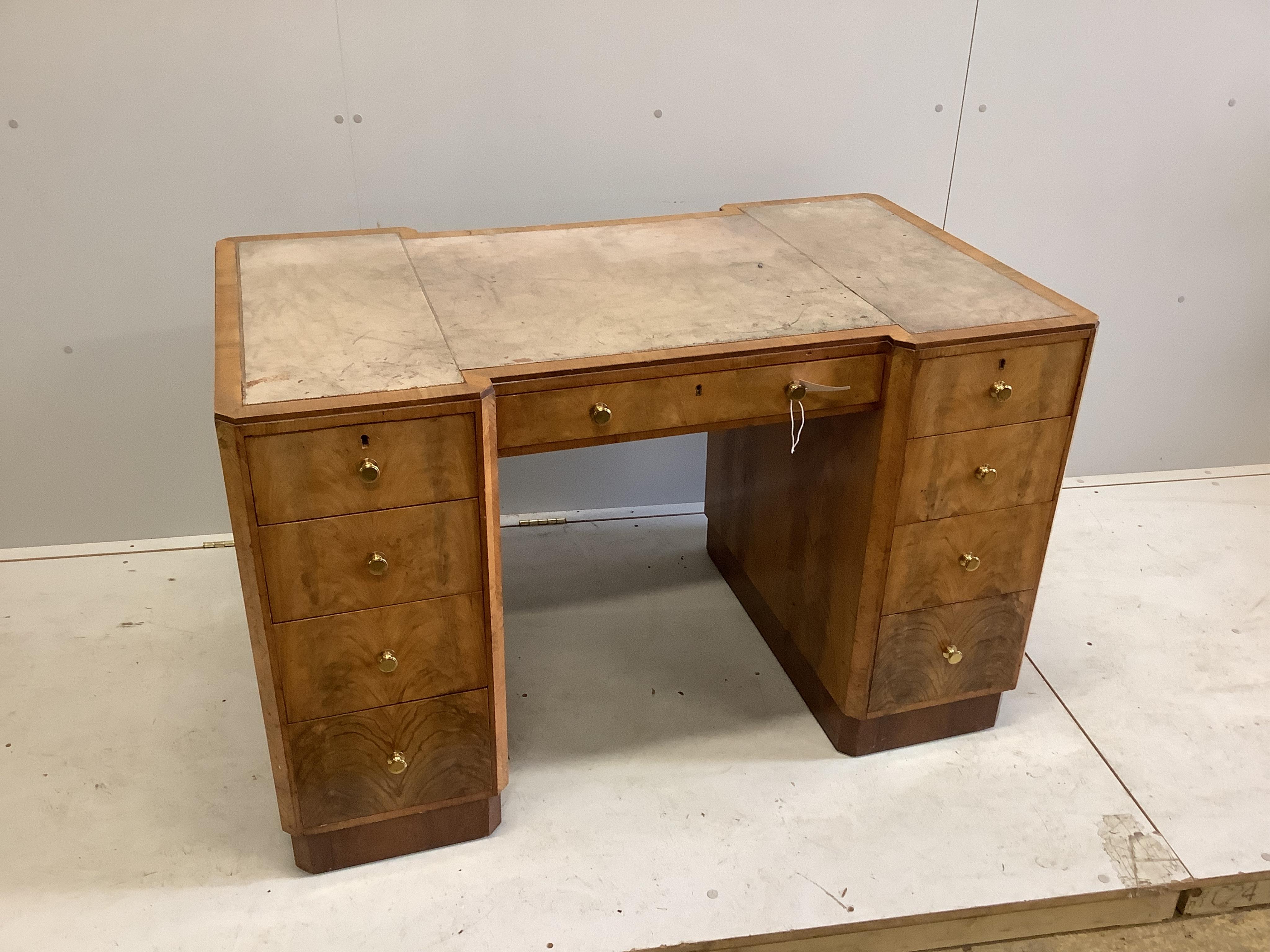 An Art Deco maplewood desk, width 122cm, depth 72cm, height 76cm. Condition - fair